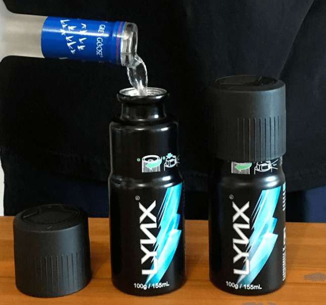 a person pouring liquid into a bottle