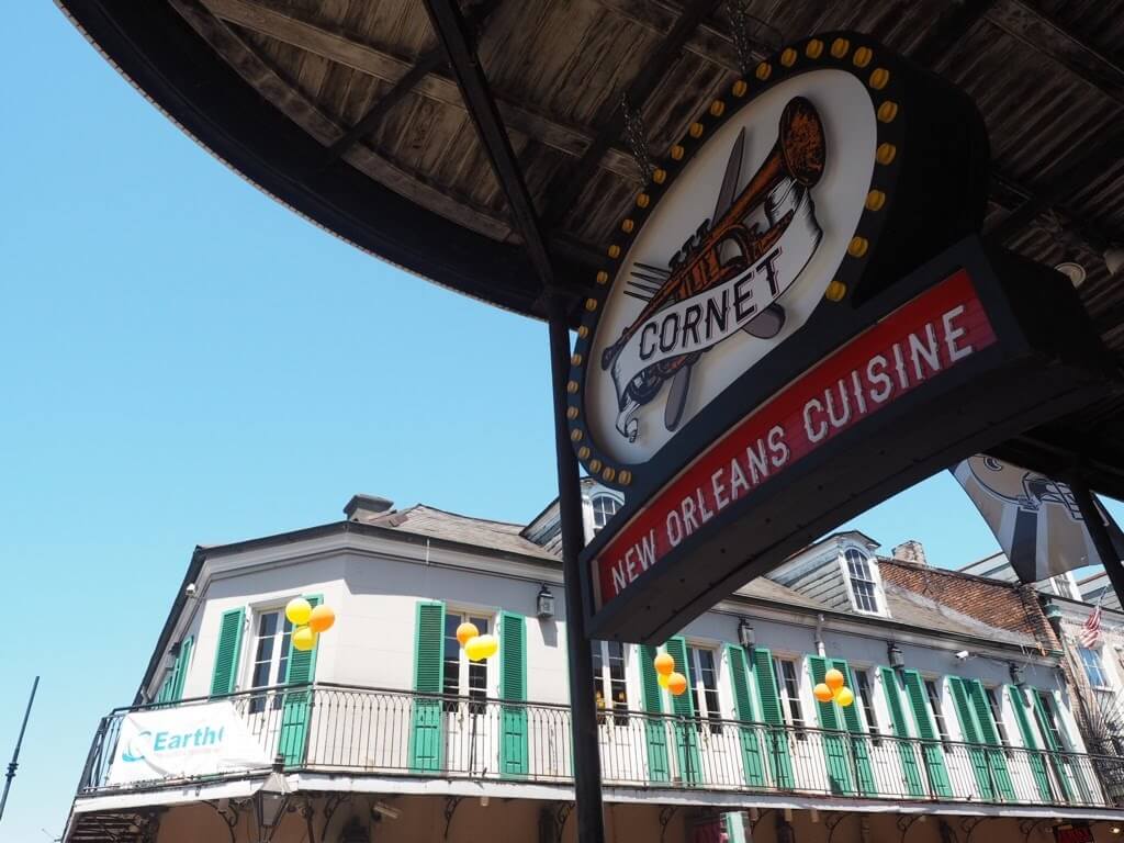 new orleans cuisine sign on Bourbon Street