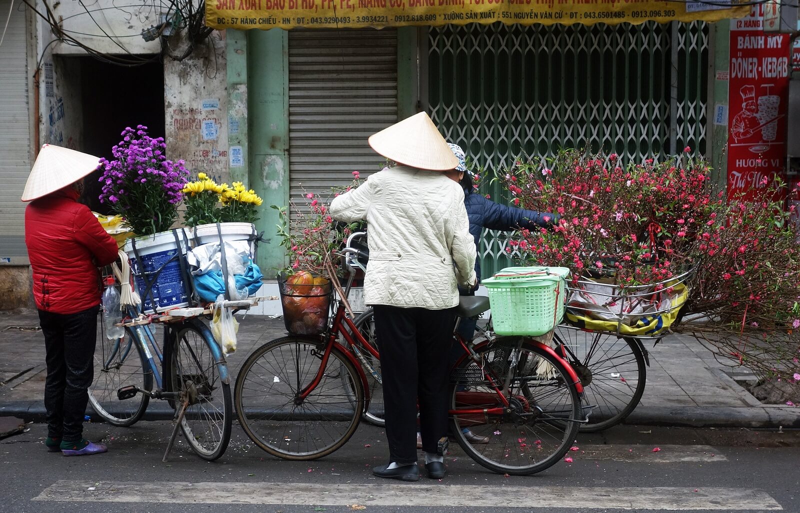 lady and a bike in vietnam