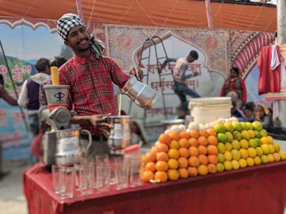 Friendly guy at the orange stand Kumbh Mela