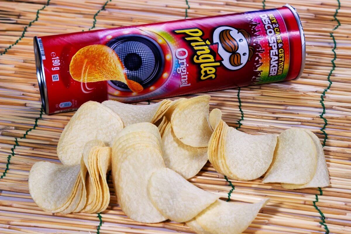 a load of spilled pringles next to an open can