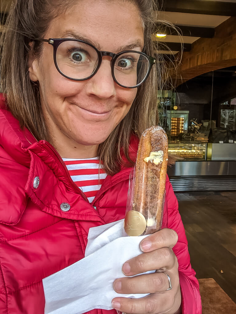 Eating the Club Harie eclair