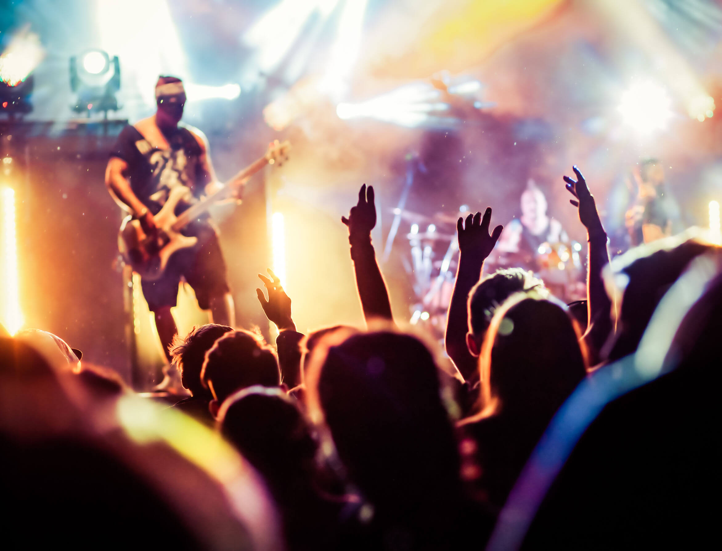 crowd with raised hands at concert - summer music festival