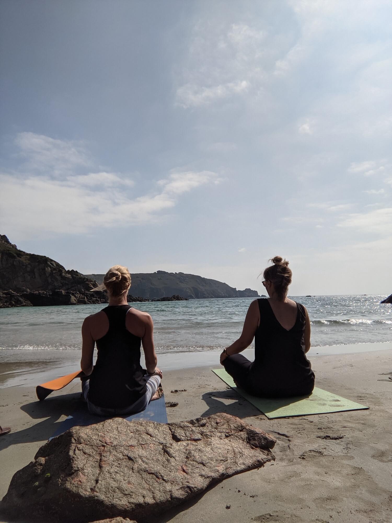 Sitting for yoga on Petit Bot Beach