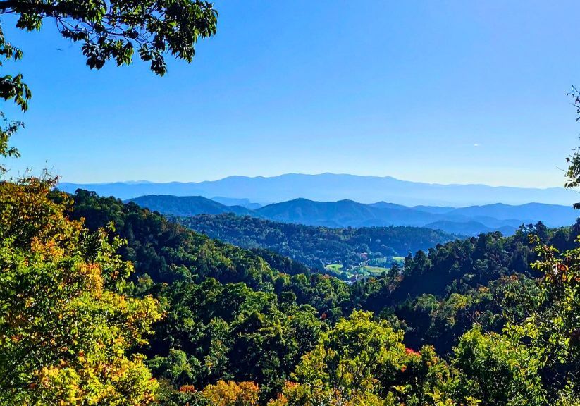 Stunning mountain view with vibrant foliage.
