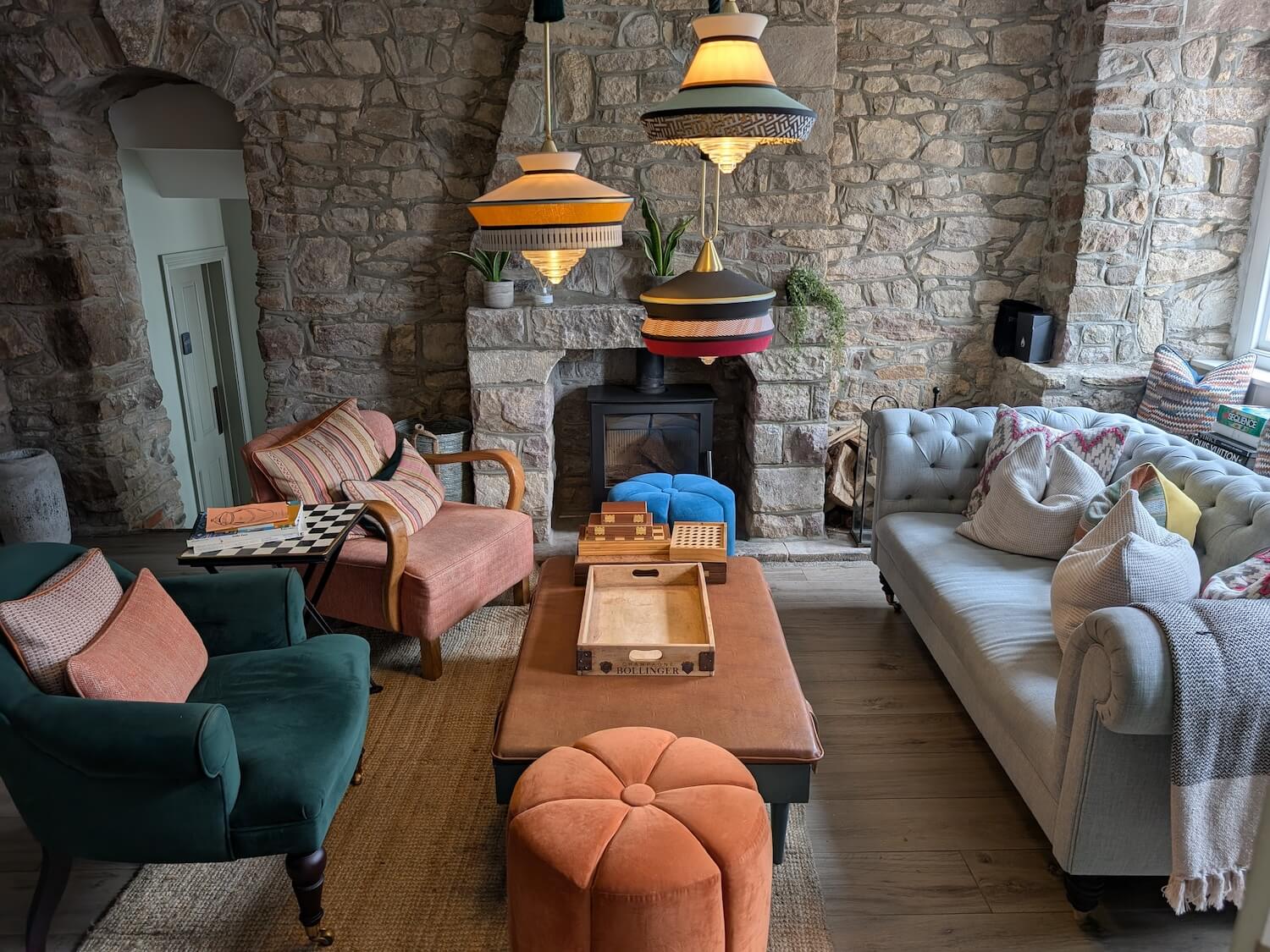 a living room with a fireplace and couches