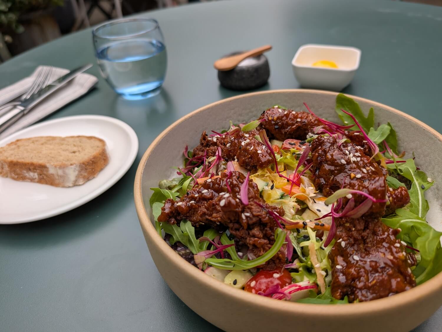 a bowl of salad with meat and vegetables